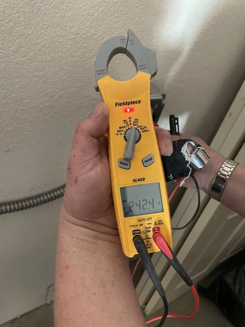 Voltage testing with clamp meter during Electrical Installation Services in Venus